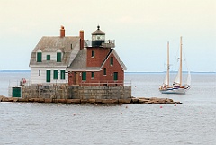Sailboat Passes Rockland Breakwater Light on a Calm Day